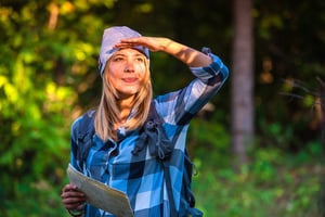 young-confident-woman-holding-a-map